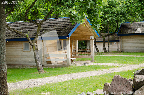 Image of wooden cottage of recreation park in summer time 