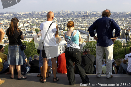 Image of People watching sunset over paris skyline from the steps of the sacre coeur montmartre