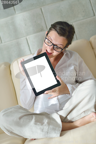 Image of woman using tablet pc at home