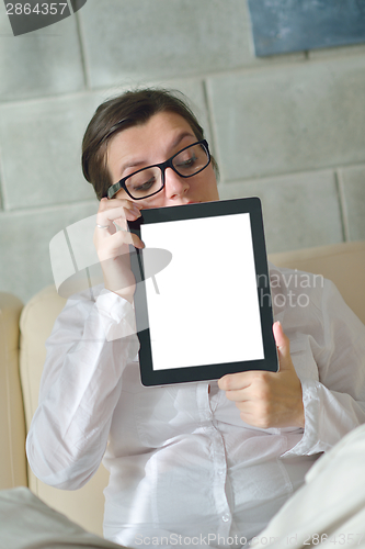 Image of woman using tablet pc at home