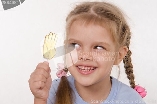 Image of Five year old girl looking for fun candy