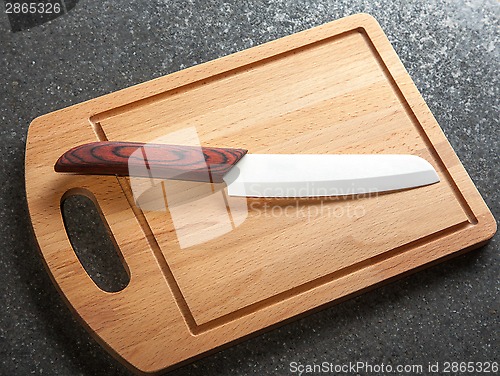 Image of kitchen knife on cutting board 