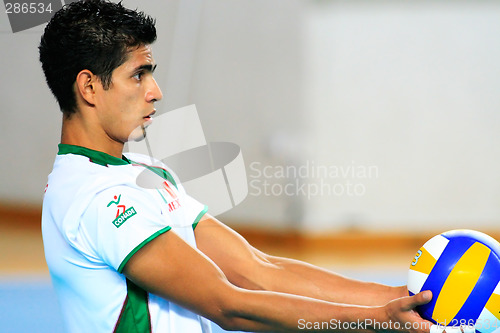 Image of Player Holding the ball. Universiade Volleyball game between Rus