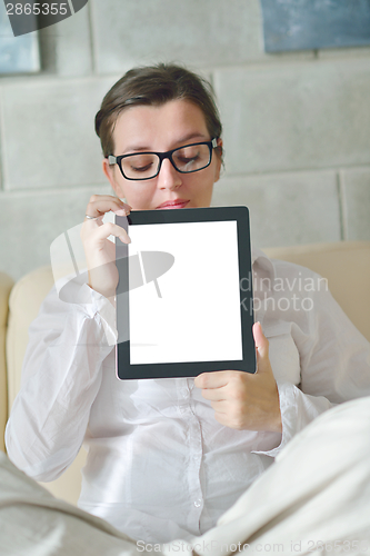 Image of woman using tablet pc at home