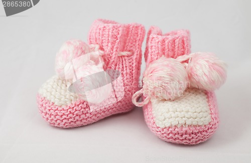 Image of pink baby's bootees