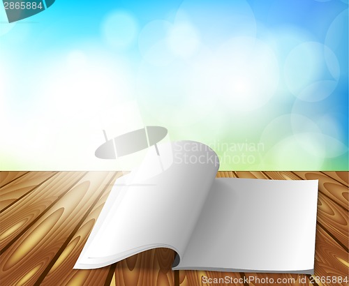 Image of Magazine on wooden table