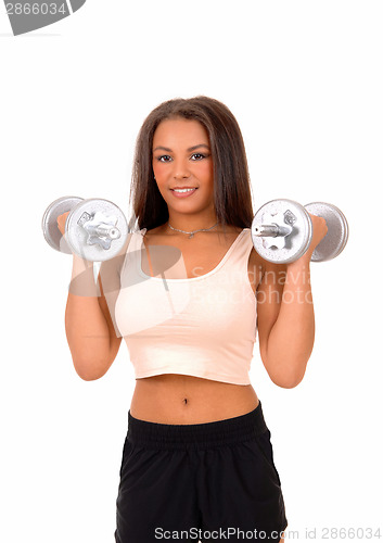 Image of Woman lifting dumbbell's.