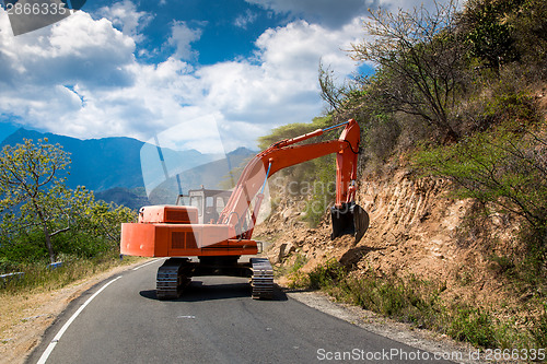 Image of Excavator repair the road.