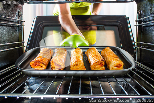 Image of Cooking in the oven at home.