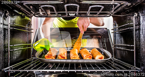 Image of Cooking in the oven at home.