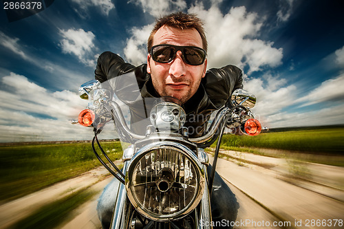 Image of Funny Biker racing on the road