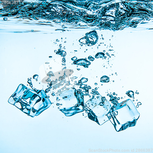 Image of Ice cubes falling under water