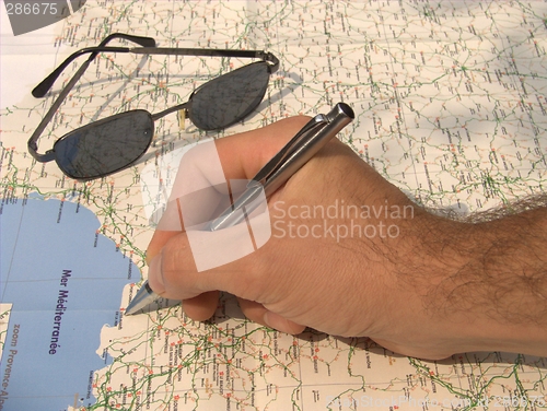 Image of hand on map