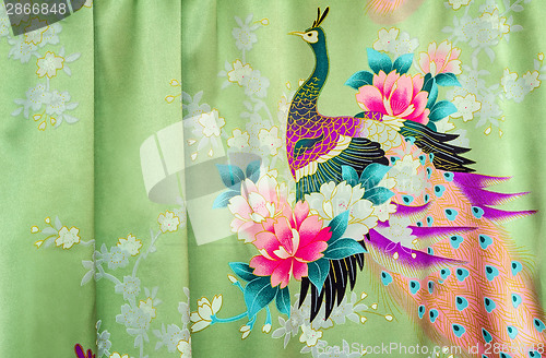 Image of Fragment of beautiful silk fabric with the image of flowers and 