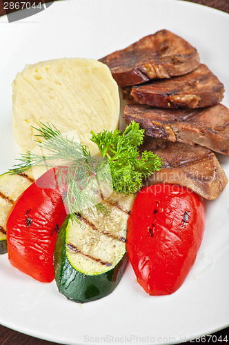 Image of tongue with grilled vegetable