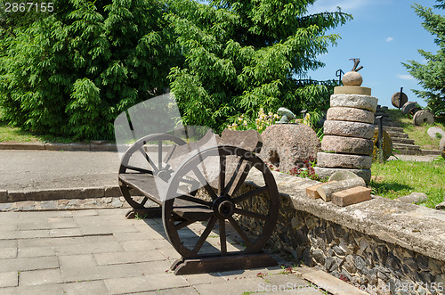 Image of bench wheel carriage rail stacked tower millstones 