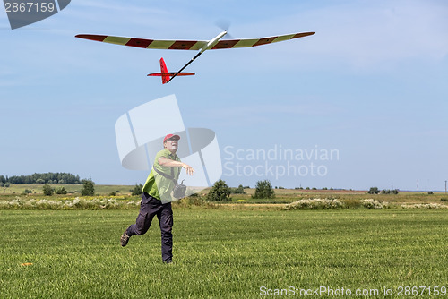 Image of Man launches into the sky RC glider