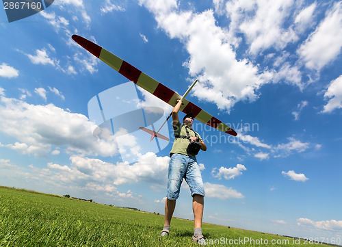 Image of Man launches into the sky RC glider