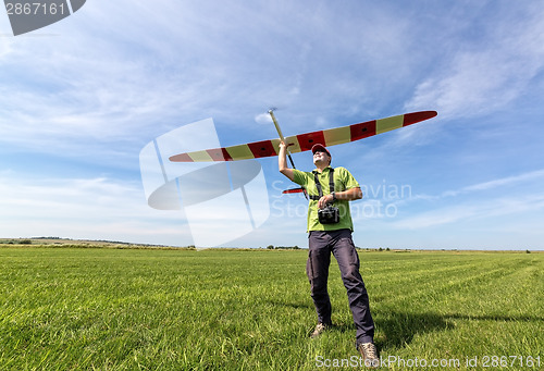 Image of Man launches into the sky RC glider