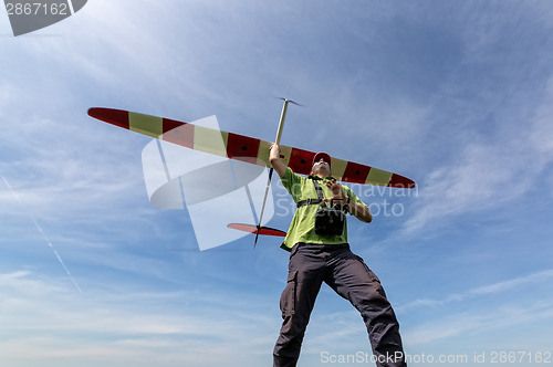 Image of Man launches into the sky RC glider