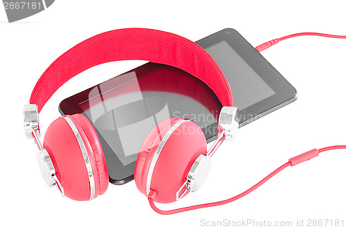 Image of Bright red headphones and black tablet pc