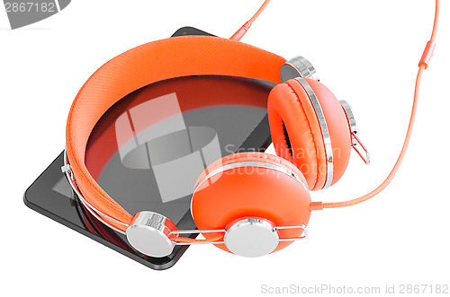 Image of Vivid orange headphones and black tablet pc