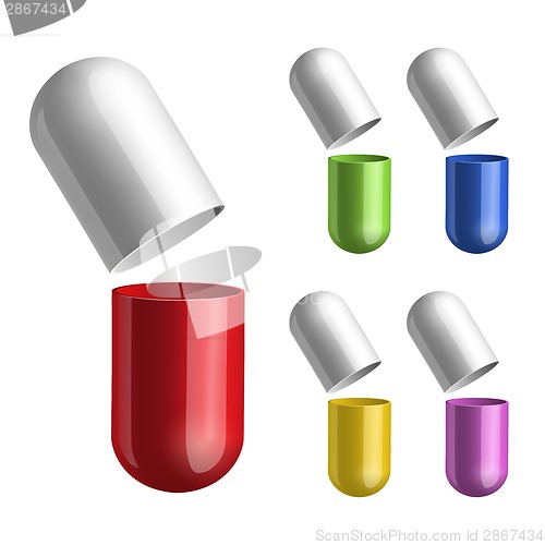 Image of Set of pills opened in two halfs .