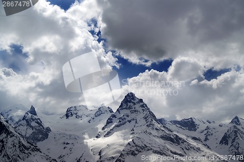 Image of Evening mountains in sunlight clouds