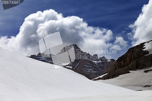 Image of Rocks with clouds and snow plateau