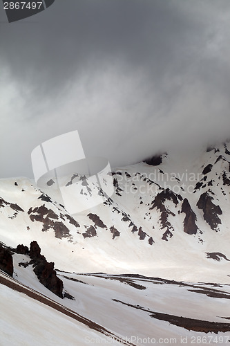 Image of Snowy mountains in fog