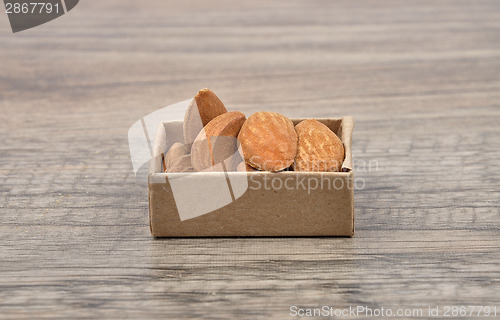 Image of Almonds on wood