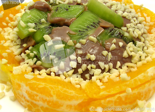 Image of Chocolate pudding with kiwi fruit, orange and little pieces of a