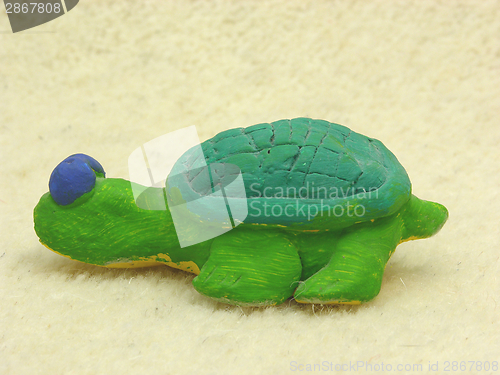 Image of Hand made ceramic turtle on soft background