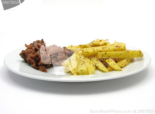 Image of Soy Geschnetzeltes and french fries on white plate