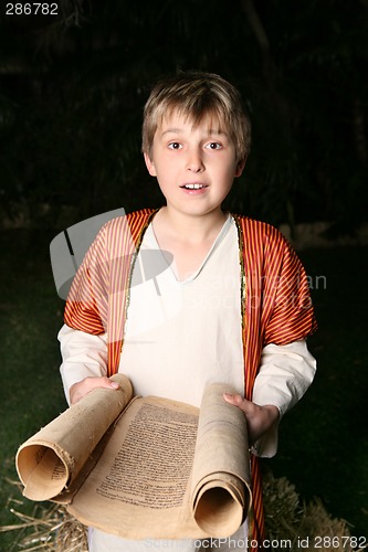 Image of Boy reading a scroll