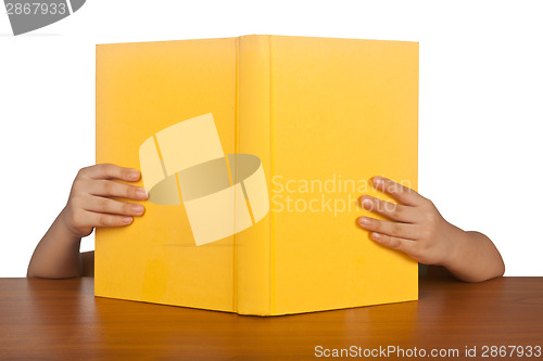 Image of Kid reading a book