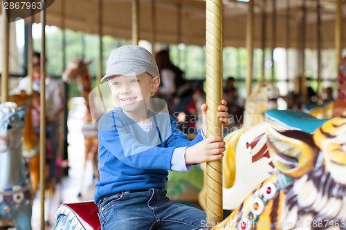 Image of boy at carousel