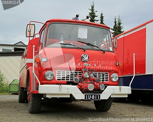 Image of Red Vintage Bedford Tank Truck in a Show