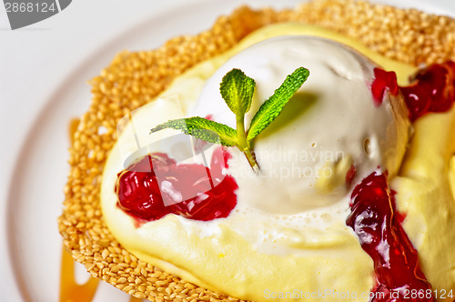 Image of cake with jam ice cream