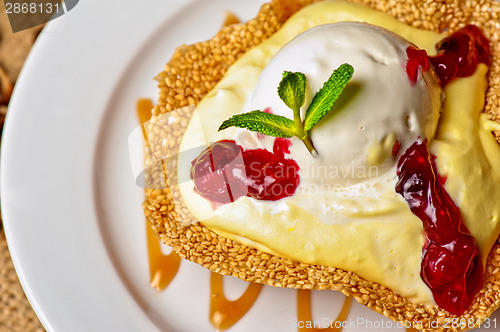 Image of cake with jam ice cream