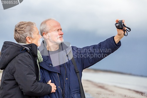 Image of Elderly couple taking a self portrait