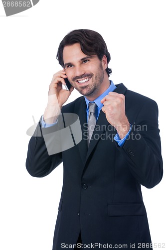 Image of Stylish businessman talking on his mobile phone