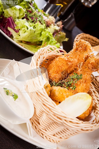 Image of Crisp crunchy golden chicken legs and wings