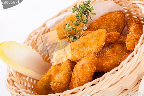 Image of Crumbed chicken nuggets in a basket