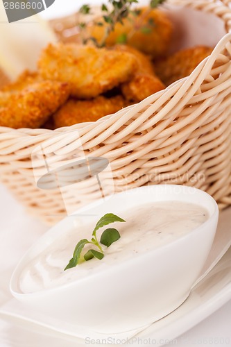 Image of Crumbed chicken nuggets in a basket