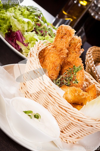 Image of Crisp crunchy golden chicken legs and wings