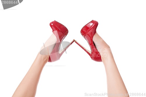 Image of Sexy bare female legs in elegant red stilettos