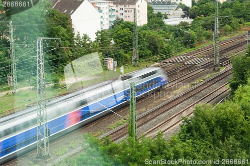 Image of Fast moving train with red stripe