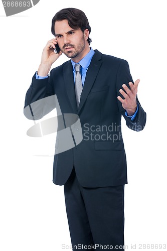 Image of Stylish businessman talking on his mobile phone