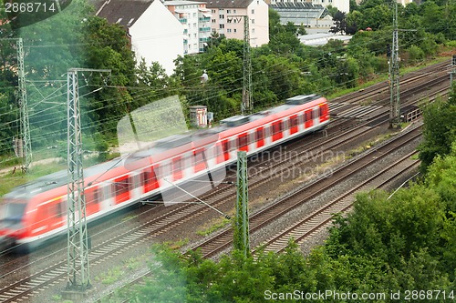 Image of Fast moving train with red stripe